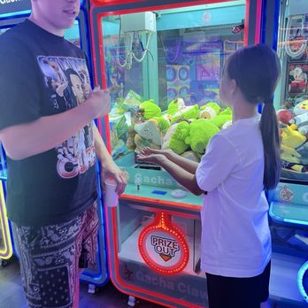 Gacha Claw - Kids strategizing their next move - Arcades Near Me - Las Vegas, Nevada