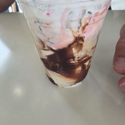 Hot fudge sundae without hot fudge. Has minimal chocolate syrup drizzle in a cup. Was supposed to have almonds but has candy sprinkles. Hot fudge sundae without hot fudge. Has minimal chocolate syrup drizzle in a cup. Was supposed to have almonds but has candy sprinkles.