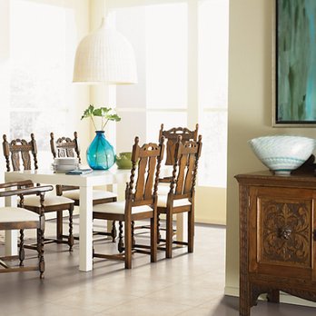 Impressive Floors - a dining room with a table and chairs - Carpeting Near Me - Bedford, Pennsylvania