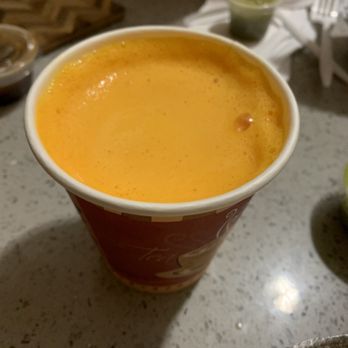Taj Mahal Indian Restaurant - Mango lassi to go in a coffee cup - Indian Near Me - Brooklyn, New York Taj Mahal Indian Restaurant - Mango lassi to go in a coffee cup - Indian Near Me - Brooklyn, New York
