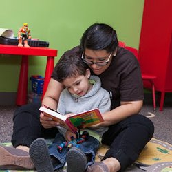 Behavioral Innovations - Reading a book to a child