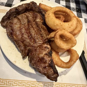 Charlie Blood's - Ribeye 12oz Steak with onion rings - Bars Near Me - Garfield, New Jersey