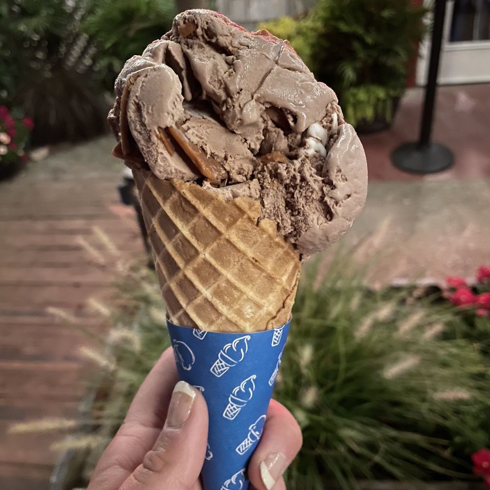 Hershey's peanut butter cup scoop on waffle cone Hershey's peanut butter cup scoop on waffle cone