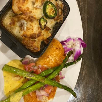Sunset Steakhouse at Fortune Bay - Halibut and gratin potatoes - Steakhouses Near Me - Tower, Minnesota Sunset Steakhouse at Fortune Bay - Halibut and gratin potatoes - Steakhouses Near Me - Tower, Minnesota
