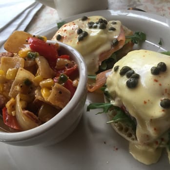 Mayfel's - Kodiak Benedicts: 2 Poached Eggs on toasted Eng. Muffin w/ Hollandaise. Smoked Salmon, Arugula, Tomato & Capers, Corn Maque Choux - Southern Near Me - Asheville, North Carolina Mayfel's - Kodiak Benedicts: 2 Poached Eggs on toasted Eng. Muffin w/ Hollandaise. Smoked Salmon, Arugula, Tomato & Capers, Corn Maque Choux - Southern Near Me - Asheville, North Carolina