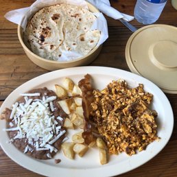 a plate of taco and potatoes