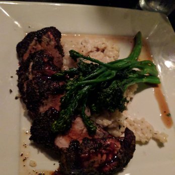 Scratch Kitchen & Cocktails - Crusted pork with undercooked Risotto and broccolini. - New American Near Me - Norman, Oklahoma