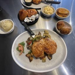 The blackened chicken and the Peanut chicken The jalapeño cornbread Mac n cheese, hushpuppies, corn , and fried green tomatoes The blackened chicken and the Peanut chicken The jalapeño cornbread Mac n cheese, hushpuppies, corn , and fried green tomatoes