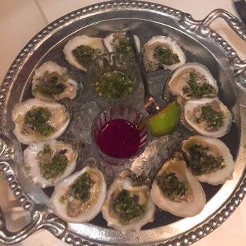 Xochi - Ostiones en su Concha  raw oysters, tomatillo mignonette - Mexican Near Me - Houston, Texas