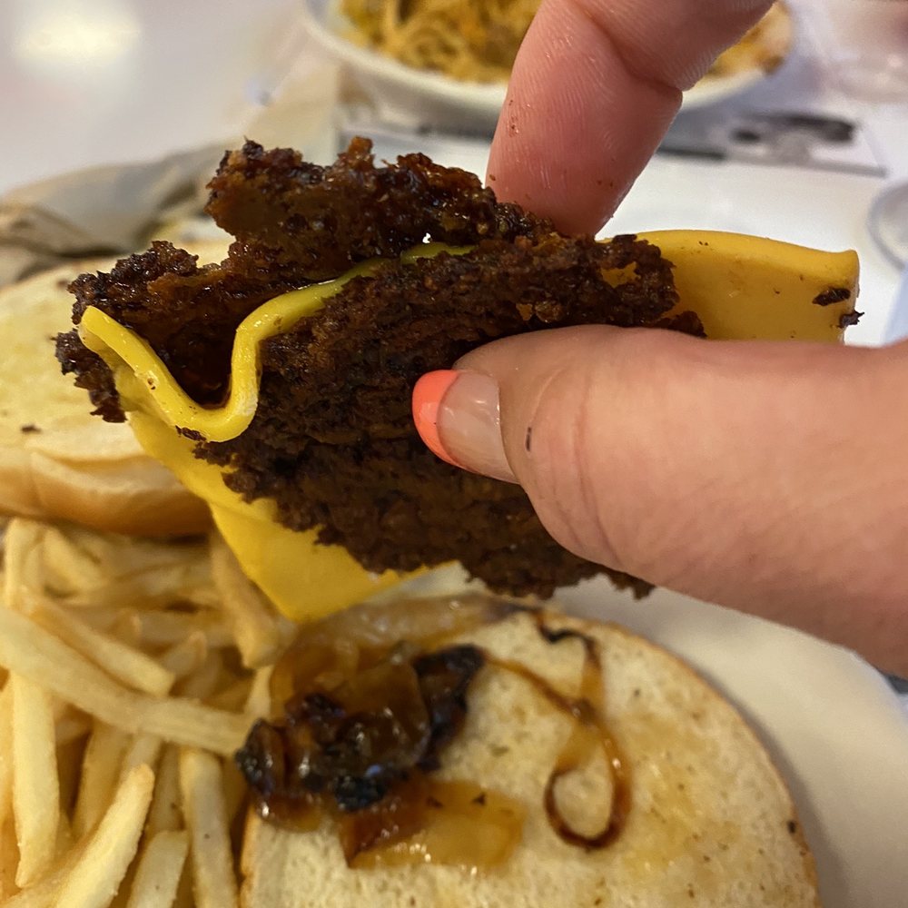 After losing our order this is what was given to me. It wasn't even what I would call a burger as it was rock hard and cold. After losing our order this is what was given to me. It wasn't even what I would call a burger as it was rock hard and cold.
