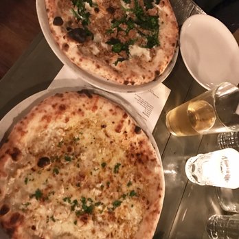 Hersh's - Abruzzo (sausage and broccolini) on top and garlic/lemon clam pie (salty and couldn't taste the clams) on the bottom. - Pizza Near Me - Baltimore, Maryland Hersh's - Abruzzo (sausage and broccolini) on top and garlic/lemon clam pie (salty and couldn't taste the clams) on the bottom. - Pizza Near Me - Baltimore, Maryland