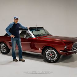 Happy customer taking delivery of his 1967 Mustang Convertible after restoration work was completed.