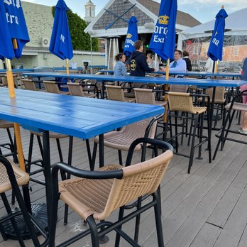 Aqua Bar - tables and umbrellas on a deck - Bars Near Me - Provincetown, Massachusetts