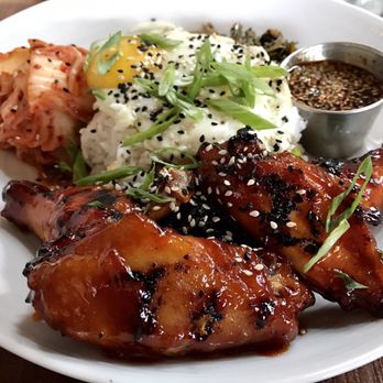 Nosh - Seoul bowl: steamed rice, Korean glazed wings, fried egg, kimchi, pickles, charred scallion salad, soy vinaigrette. - New American Near Me - Rochester, New York Nosh - Seoul bowl: steamed rice, Korean glazed wings, fried egg, kimchi, pickles, charred scallion salad, soy vinaigrette. - New American Near Me - Rochester, New York
