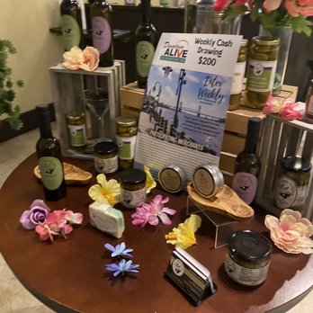 The Olive Shoppe - a table with a variety of products on it - Specialty Food Near Me - Wilmington, North Carolina The Olive Shoppe - a table with a variety of products on it - Specialty Food Near Me - Wilmington, North Carolina