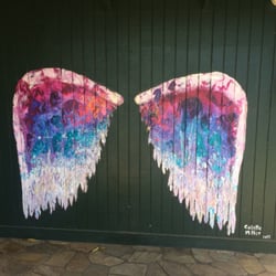 Rainbow Bridge Gift Shop - You can stand in front of this painted wall and be an angel