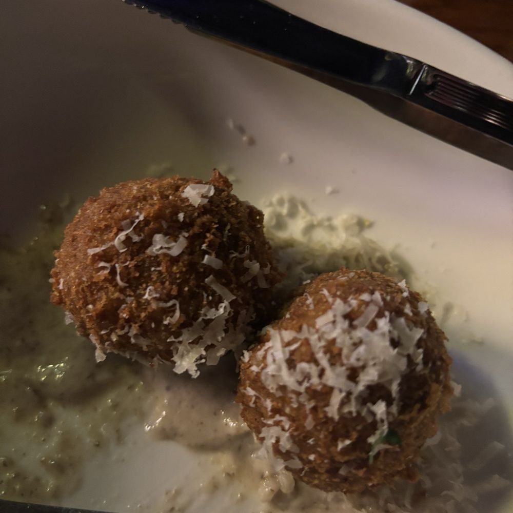 2/3 truffle arancini after I devoured the first one! 2/3 truffle arancini after I devoured the first one!