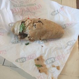 a pita sandwich on a wrapper a pita sandwich on a wrapper