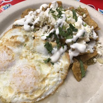 Fonda La Catrina - Over medium eggs with chiliquilas. - Mexican Near Me - Seattle, Washington Fonda La Catrina - Over medium eggs with chiliquilas. - Mexican Near Me - Seattle, Washington