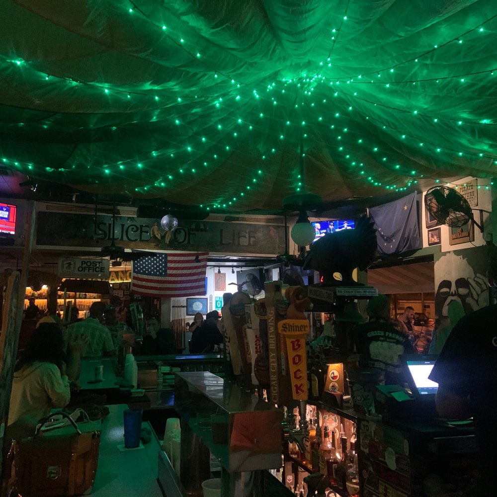 Green Parrot - people sitting at a bar with green lights - Dive Bars Near Me - Key West, Florida Green Parrot - people sitting at a bar with green lights - Dive Bars Near Me - Key West, Florida