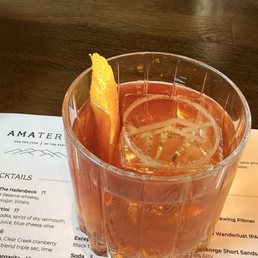 Old fashioned with ice cube with the Amaterra logo Old fashioned with ice cube with the Amaterra logo
