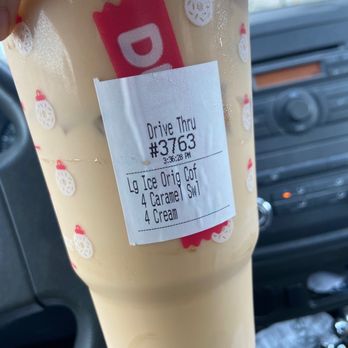 Dunkin' - a person holding a cup of coffee - Donuts Near Me - Fort Myers, Florida Dunkin' - a person holding a cup of coffee - Donuts Near Me - Fort Myers, Florida