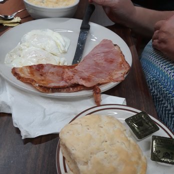 The Brick House Cafe - A homemade biscuit, ham and eggs, and cheese grits. - Breakfast & Brunch Near Me - Plant City, Florida The Brick House Cafe - A homemade biscuit, ham and eggs, and cheese grits. - Breakfast & Brunch Near Me - Plant City, Florida