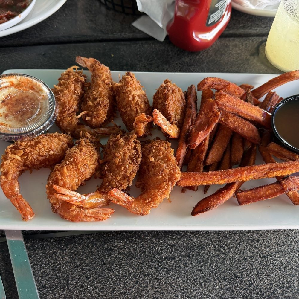 Coconuts On The Beach - Coconut Crusted Shrimp with sweet potato fries - Bars Near Me - Cocoa Beach, Florida Coconuts On The Beach - Coconut Crusted Shrimp with sweet potato fries - Bars Near Me - Cocoa Beach, Florida