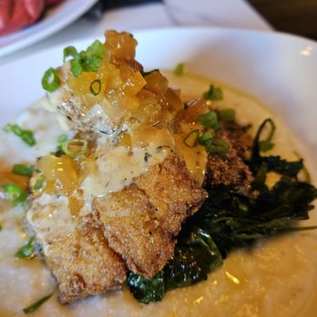Uptown Social - Fish and grits with sauté greens - Cocktail Bars Near Me - Boston, Massachusetts Uptown Social - Fish and grits with sauté greens - Cocktail Bars Near Me - Boston, Massachusetts