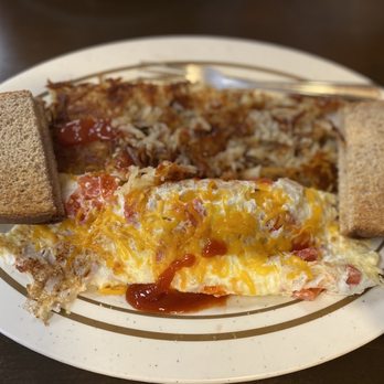Lake Alfred Diner - an omelet and bread on a plate - Diners Near Me - Lake Alfred, Florida Lake Alfred Diner - an omelet and bread on a plate - Diners Near Me - Lake Alfred, Florida