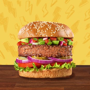 The Burger Den - a hamburger with lettuce, tomatoes, and onions - Food Delivery Services Near Me - Hayward, California The Burger Den - a hamburger with lettuce, tomatoes, and onions - Food Delivery Services Near Me - Hayward, California