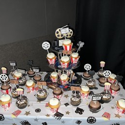 Cupcakes on display at a movie theater birthday party Cupcakes on display at a movie theater birthday party