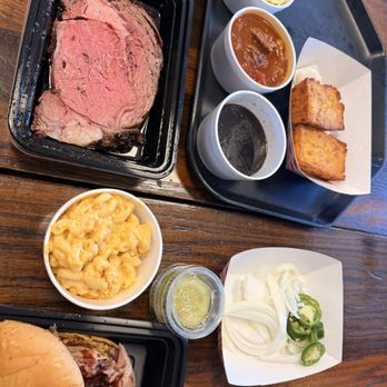 WoodBarn BBQ - Prime rib with au jus, bbq pork sandwich, Johnny cakes, mac n'cheese, coleslaw, brisket chili, pickles, onions and jalapenos. - Barbeque Near Me - Queen Creek, Arizona WoodBarn BBQ - Prime rib with au jus, bbq pork sandwich, Johnny cakes, mac n'cheese, coleslaw, brisket chili, pickles, onions and jalapenos. - Barbeque Near Me - Queen Creek, Arizona