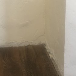 The Doctors Center - Urgent Care - No floor board trim and peeling stucco