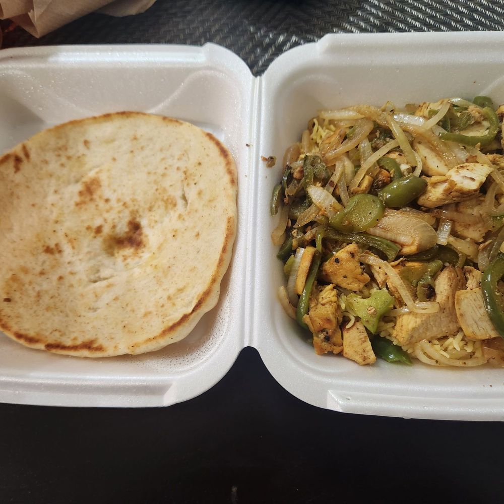 Chicken rice and veggies plate with pita bread Chicken rice and veggies plate with pita bread