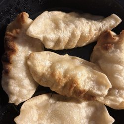 Fried Dumplings. Comes with a chili oil that is delicious and not spicy. I'd get these again for sure.