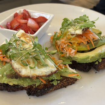 Mountain Lotus Cafe - Avocado toast: Two slices, fried egg, carrot, microgreens, side of strawberries - Salad Near Me - Truckee, California Mountain Lotus Cafe - Avocado toast: Two slices, fried egg, carrot, microgreens, side of strawberries - Salad Near Me - Truckee, California