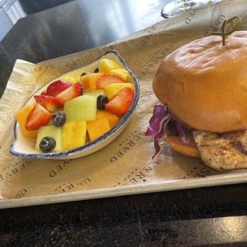 Unreserved Beer Garden - Mahi mahi sandwich (SO tasty pics don't do it justice) with side of fruit - Beer Gardens Near Me - Orlando, Florida