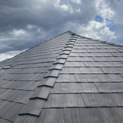 White Mountain Roofing - Metal Tile roof installed. This project was tricky due to the steepness and complexity, but White mountain Roofing knocked it out the park.