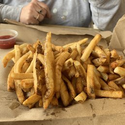 a pile of french fries on a table