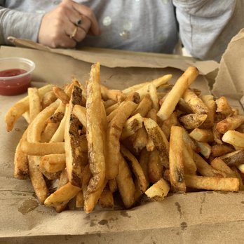 Five Guys - a pile of french fries on a table - Burgers Near Me - Chilliwack, British Columbia