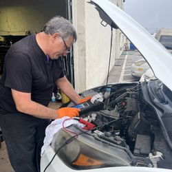 Ken's Automotive - Phil doing a battery diagnostic test.