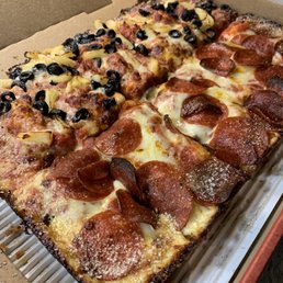 Half black olive, pineapple, bacon. Half pepperoni. Half black olive, pineapple, bacon. Half pepperoni.