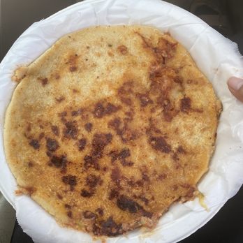 Las Flores Cafe - a person holding a plate of food - Mexican Near Me - Greenbrae, California
