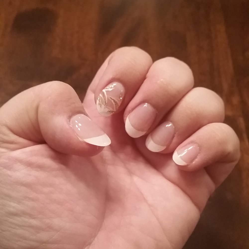 French oval shellac nails with design. French oval shellac nails with design.