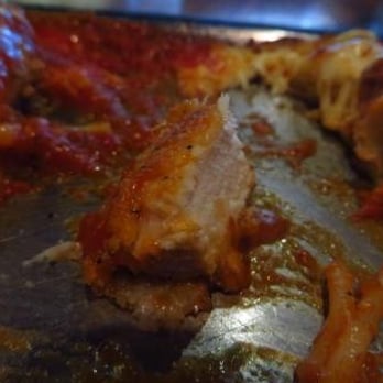 Tomasso's Italian Grille - a half eaten pizza - Italian Near Me - Trenton, Ontario Tomasso's Italian Grille - a half eaten pizza - Italian Near Me - Trenton, Ontario