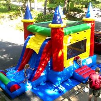 Sammy's Bounce House - Set up in two parking lot spaces in front of a townhouse. - Bounce House Rentals Near Me Sammy's Bounce House - Set up in two parking lot spaces in front of a townhouse. - Bounce House Rentals Near Me