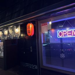 the front of a restaurant at night