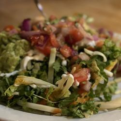Nadine's Mexican Kitchen - Salad my sister got, had a few bites. Tostada under it. REALLY good!