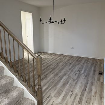 Gemcraft Homes - a living room with hardwood floors and a chandelier - General Contractors Near Me - Joppa, Maryland Gemcraft Homes - a living room with hardwood floors and a chandelier - General Contractors Near Me - Joppa, Maryland